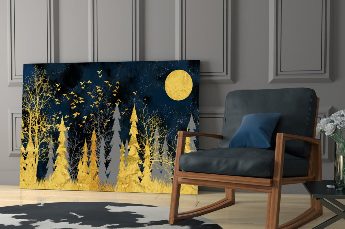 Glass wall art depicting a nighttime forest scene with golden trees, birds, and a full moon against a dark blue background, displayed in a modern room beside a wooden chair.