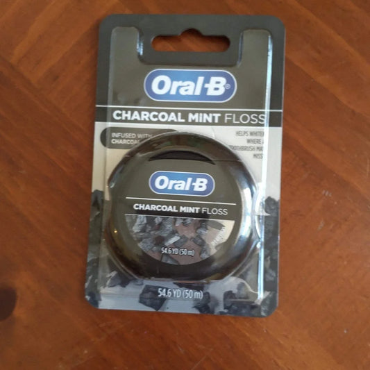 Oral-B Charcoal Mint Dental Floss Defense in black silver blister pack