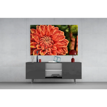 Vibrant orange dahlia glass wall art print above gray console table
