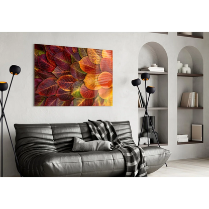 Vibrant autumn leaves glass wall art on canvas above black sofa