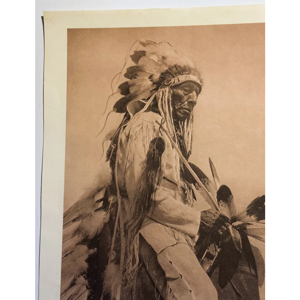 Sepia-toned Edward Sheriff Curtis photogravure of Cheyenne Native American in feather headdress
