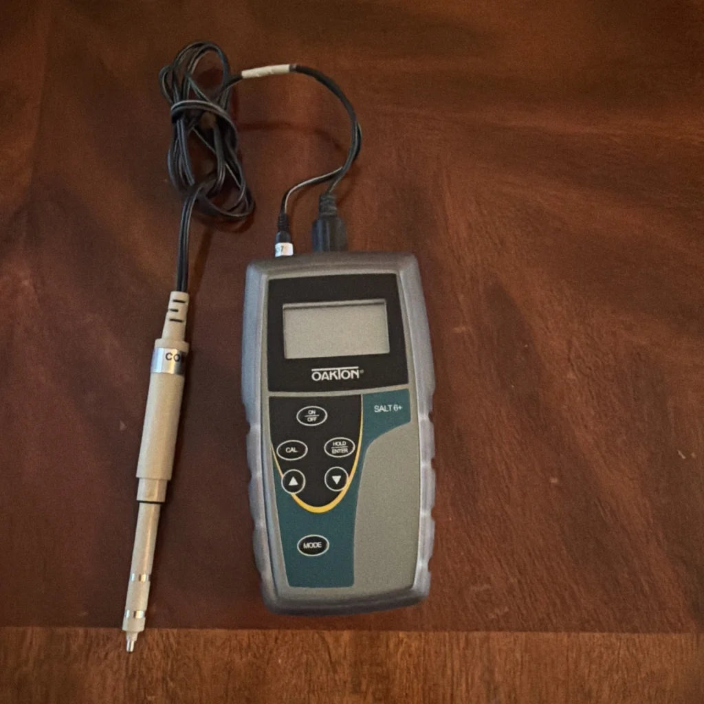 Oakton SALT 6+ handheld salinity meter with gray black body and beige probe