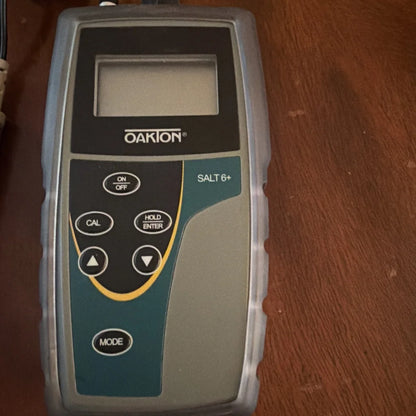 Oakton Salt 6+ handheld salinity meter with gray teal casing