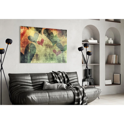 Black leather sofa with tufted cushions and plaid throw near wall art