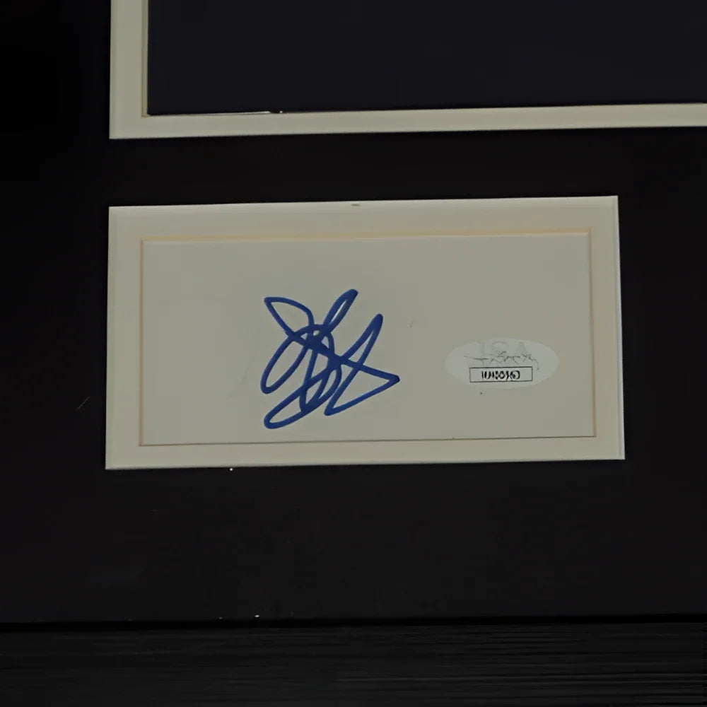 A blue ink deluxe framed signature of Jason Bateman on a cream card with laura linney autograph and JSA sticker