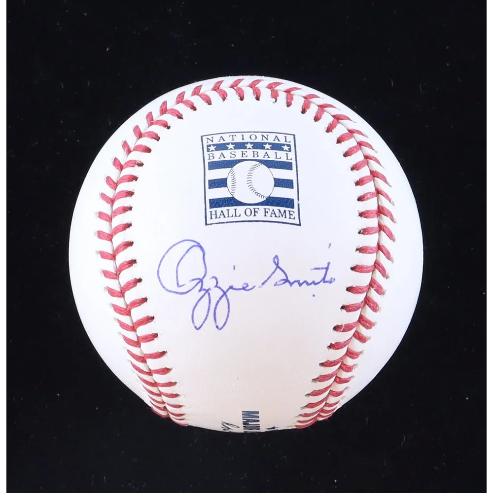 White baseball with red stitching and blue autograph in display case, Ozzie Smith signed