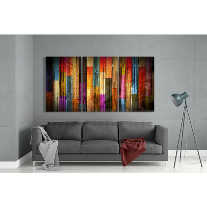 Vibrant glass wall art triptych with multicolored wood plank stripes