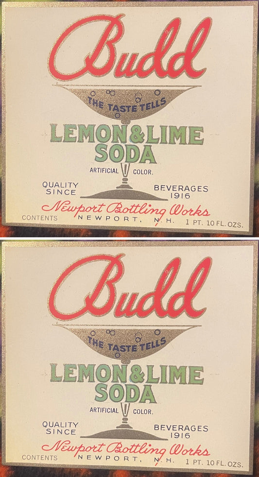Two Budd Lemon & Lime Soda labels, one above the other: red Budd script over a gold soda glass reading THE TASTE TELLS, green LEMON & LIME SODA, Newport Bottling Works, Newport, N.H.