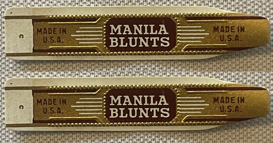 Two vintage Manila Blunts cigar bands, one above the other: MANILA BLUNTS in cream on a maroon panel, gold embossed ground with cream speed lines, MADE IN U.S.A. on both wings.