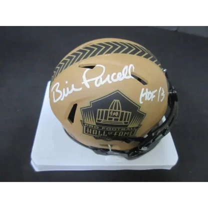 Gold football helmet with Pro Football Hall of Fame logo, Parcells signed mini helmet
