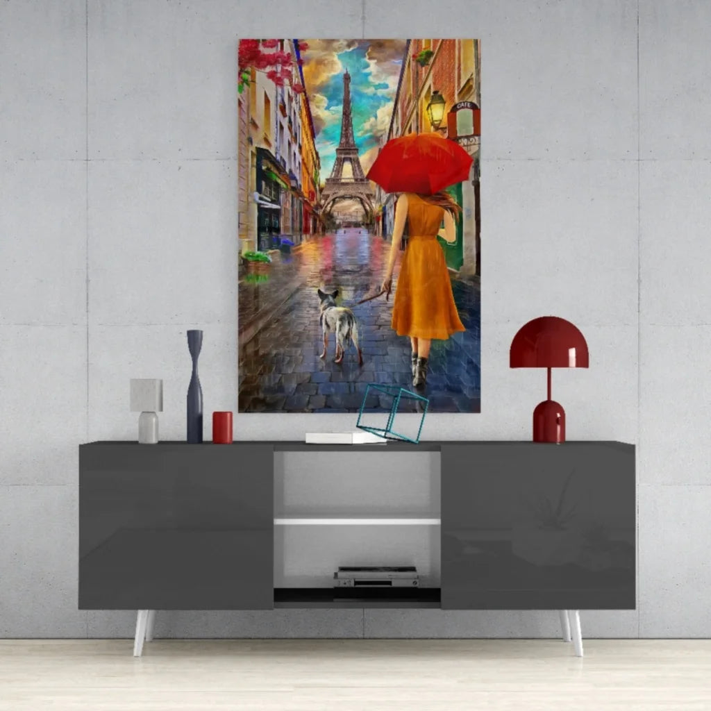 Vibrant woman in orange dress walks dog under red umbrella on rainy Paris street with Eiffel Tower - canvas wall art