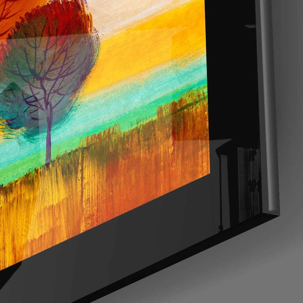 Vibrant abstract glass wall art of solitary tree in orange-yellow-teal sunset sky