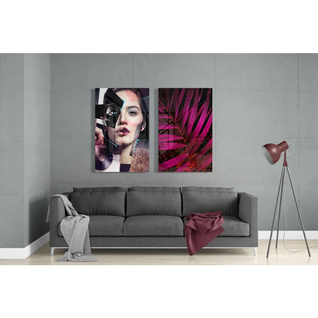 Bold abstract portrait glass wall art set with magenta leaves above gray sofa