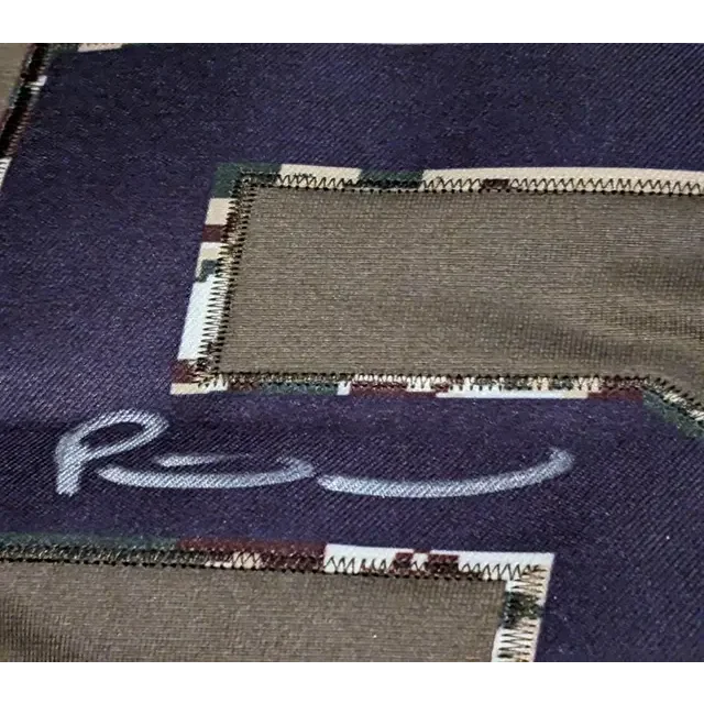 Dark blue fabric with striped patches on Patrick Mahomes autographed jersey