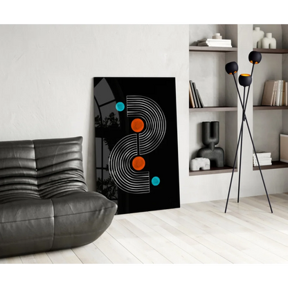 Black modern glass wall art with white concentric lines, orange teal circles