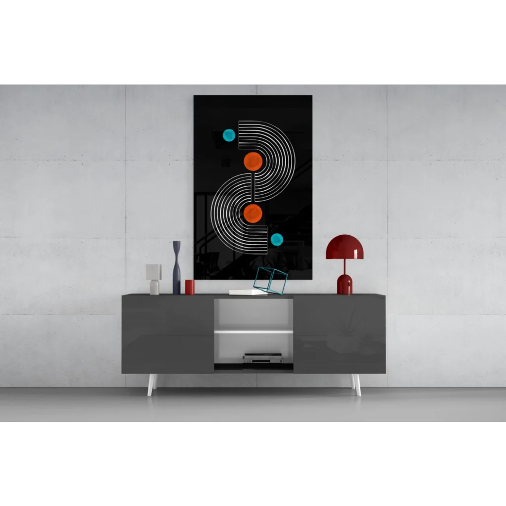 Black modern glass wall art with white concentric lines and orange teal circles