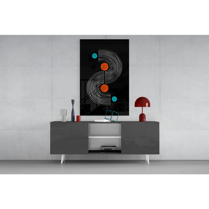 Black modern glass wall art with white concentric lines and orange teal circles