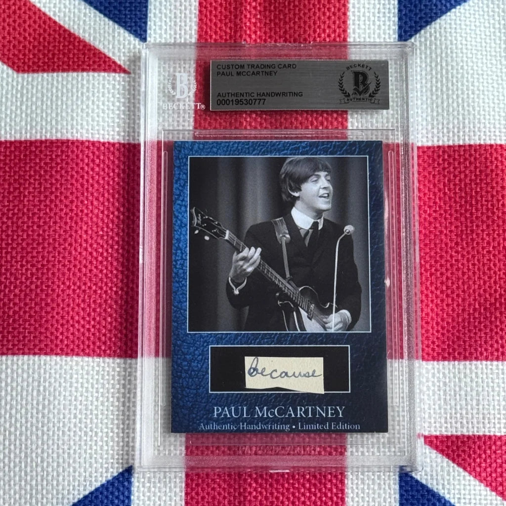 A black and white paul mccartney trading card playing guitar with authentic handwritten autograph for rock n roll fans