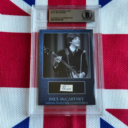 A black custom trading card featuring paul mccartney autograph and photo, sealed for rock n roll music history fans