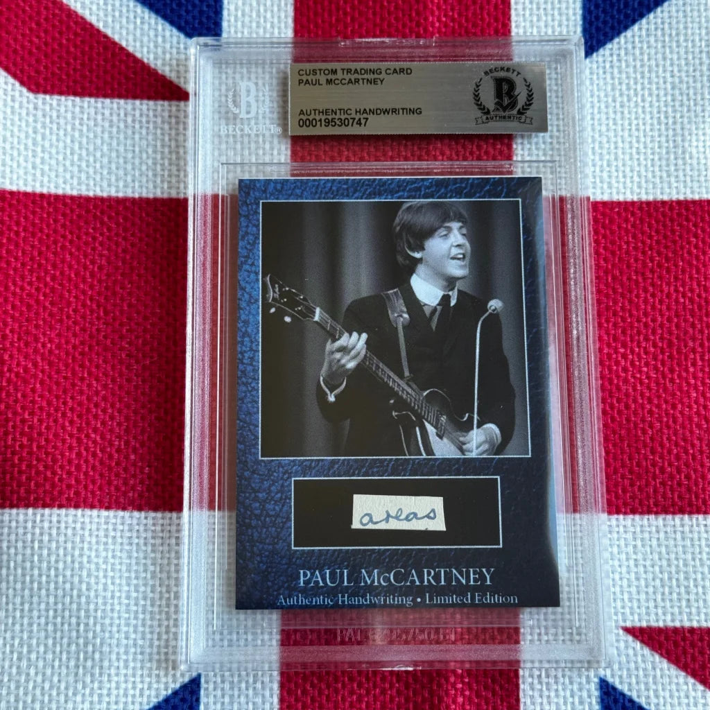 A black and white paul mccartney guitar trading card with original handwriting autograph encased in a protective slab highlighting rock n roll music history