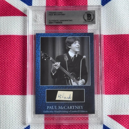A black-and-white paul mccartney autograph trading card featuring his signature and electric guitar, highlighting music history