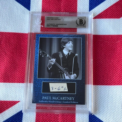 Paul McCartney graded autograph trading card with guitar and mic on black background