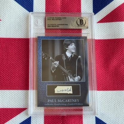 A black and white paul mccartney trading card with authentic handwriting autograph in clear protective slab highlighting rock n roll history