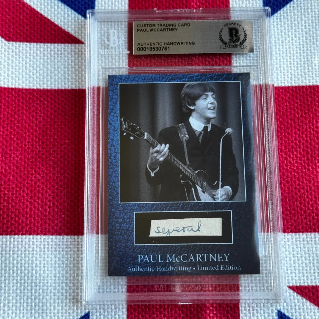 A black and white paul mccartney custom trading card with authentic handwritten signature in clear protective slab highlighting music history and rock n roll