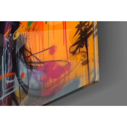 Vibrant graffiti glass wall art with bold orange pink splashes