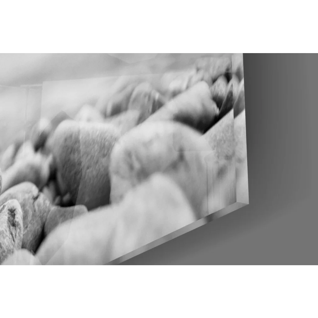 Black and white framed photo of smooth river stones wall art