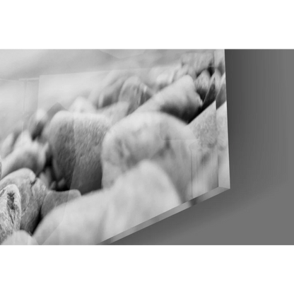 Black and white framed photo of smooth river stones wall art