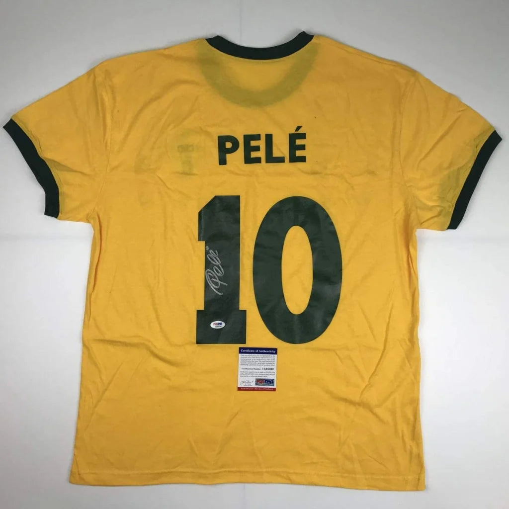 Yellow custom jersey signed by Pelé with 10, perfect for soccer fans and collectors