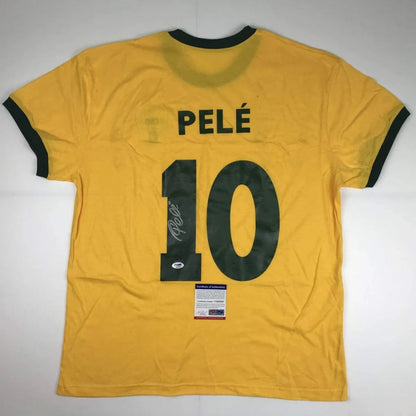 Yellow custom jersey signed by Pelé with 10, perfect for soccer fans and collectors