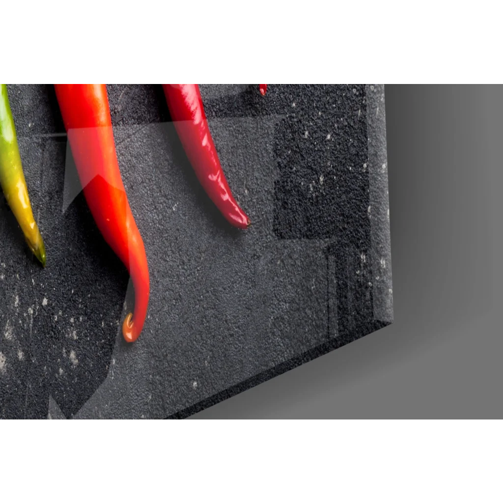 Vibrant red green chili peppers on dark stone for fiery wall art