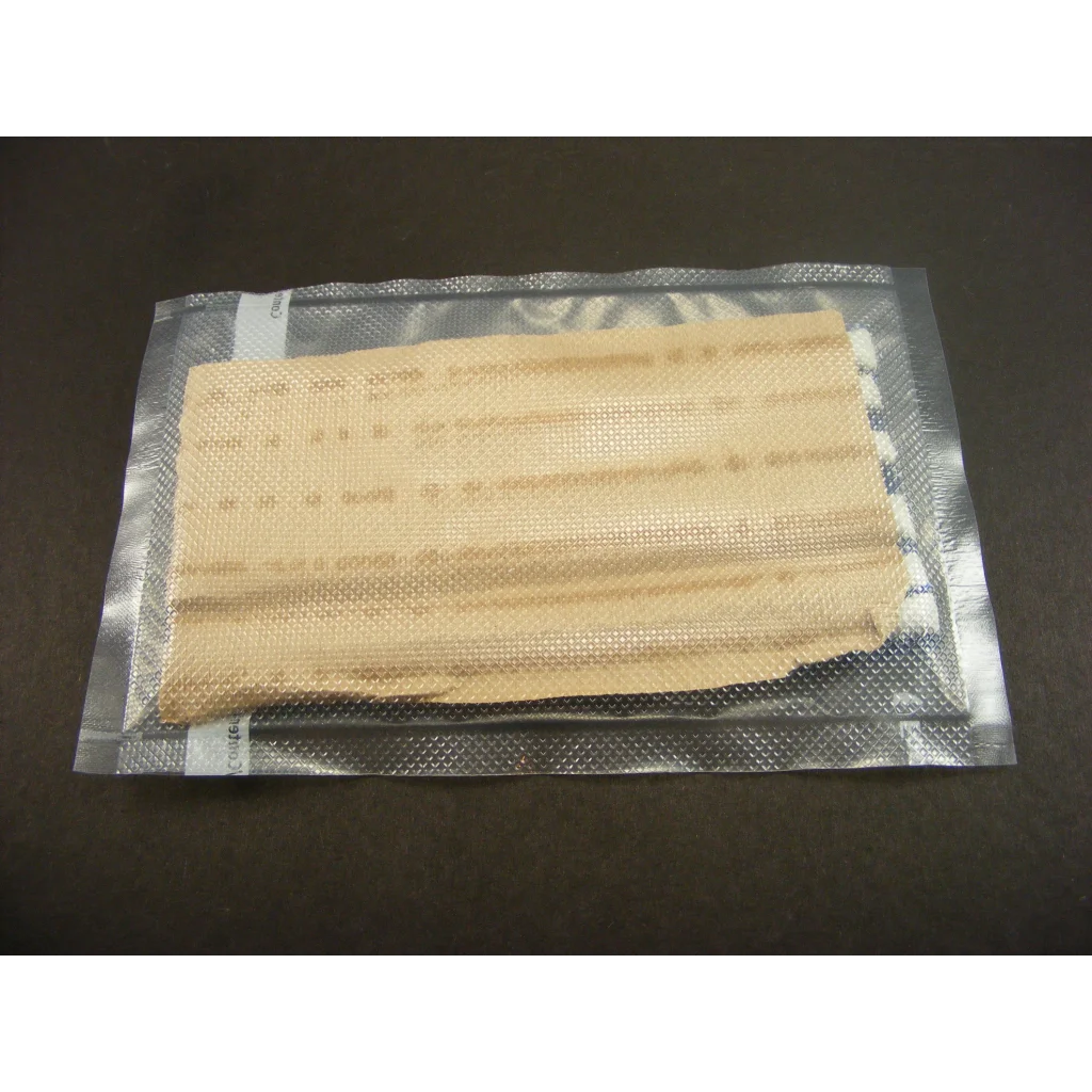 Beige textured display putty pad in silver foil package for crystals and fossils