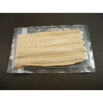 Beige textured display putty pad in silver foil package for crystals and fossils