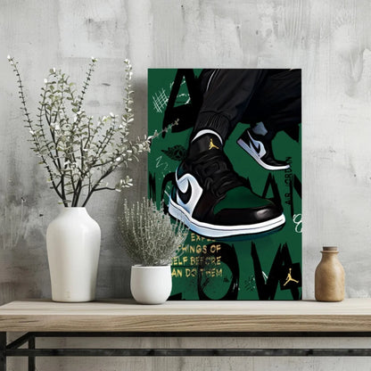 Black and white Nike Air Jordan 1 sneakers with green accents on aluminum wall print