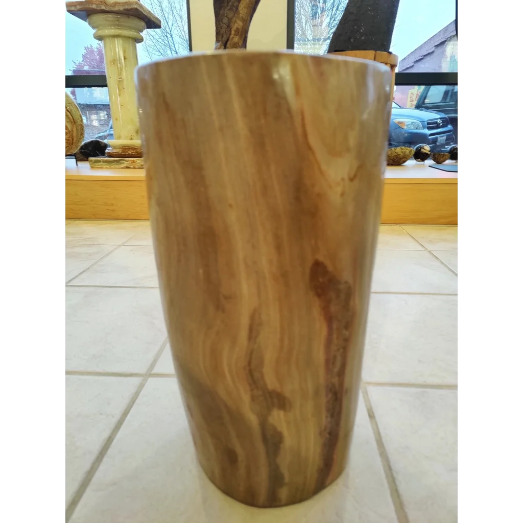 Polished petrified wood pedestal with natural grain and warm brown tones