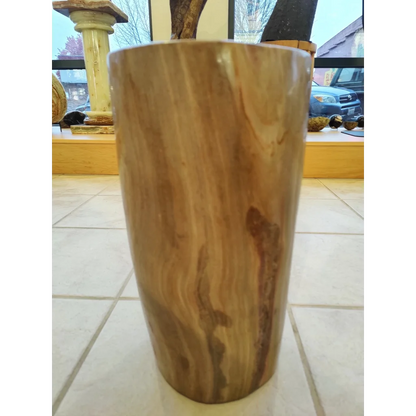 Polished petrified wood pedestal with natural grain and warm brown tones
