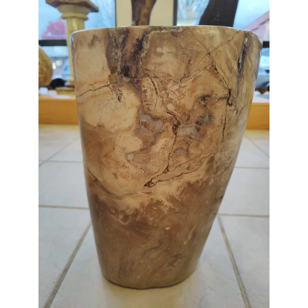 Rustic petrified wood pedestal planter with swirling beige and dark brown tones