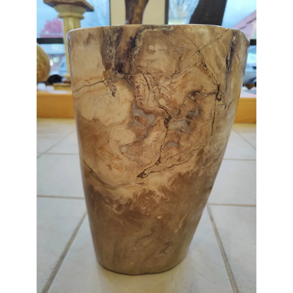 Rustic petrified wood pedestal planter with swirling beige and dark brown tones