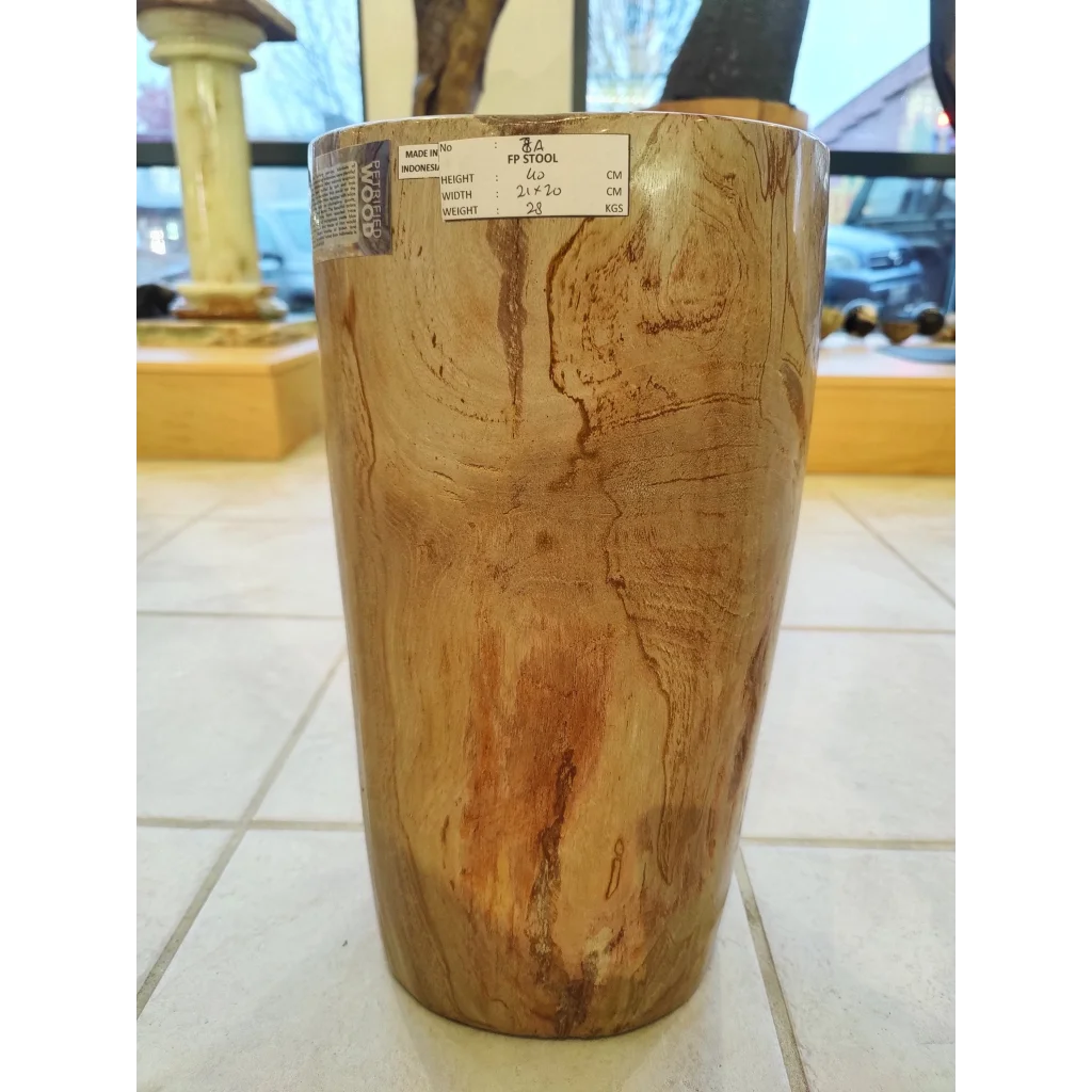 Rustic petrified wood pedestal stool with natural wood grain finish