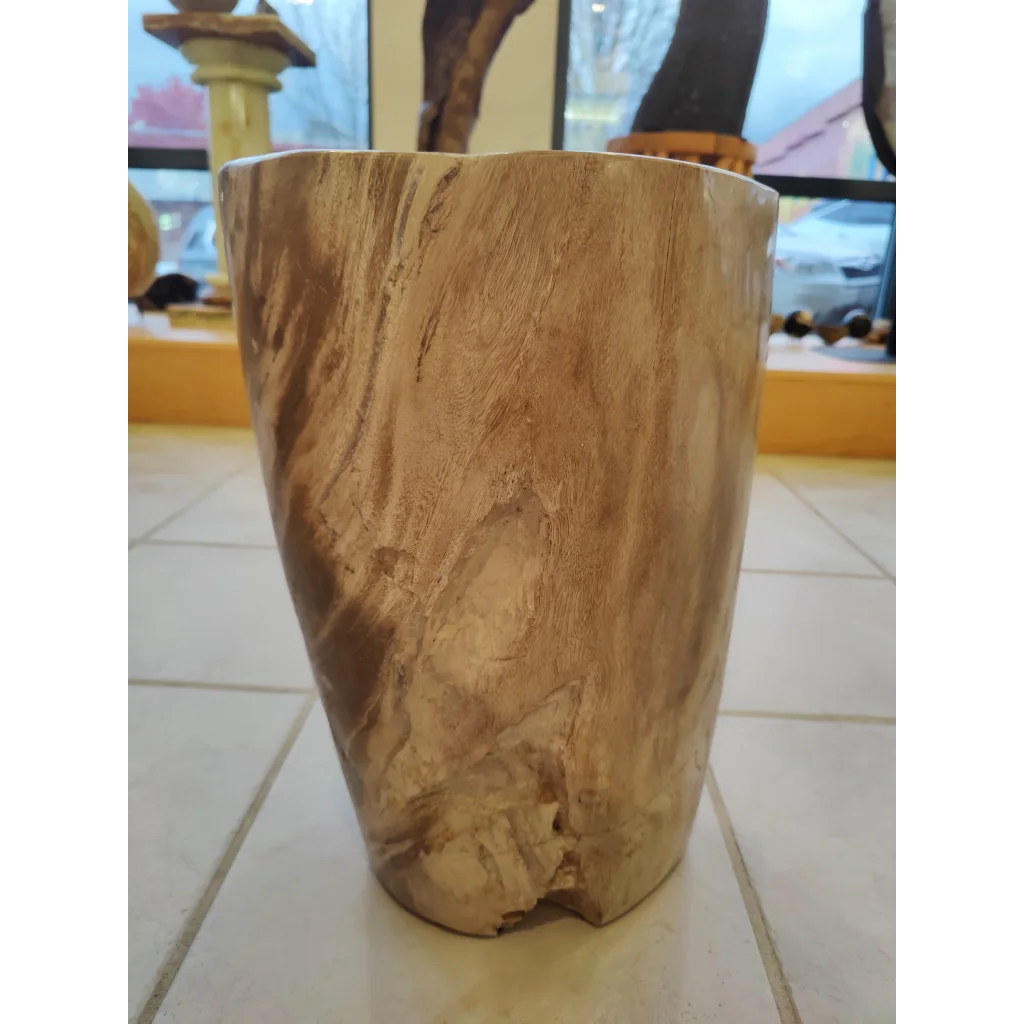 Rustic petrified wood pedestal with natural light brown grain texture
