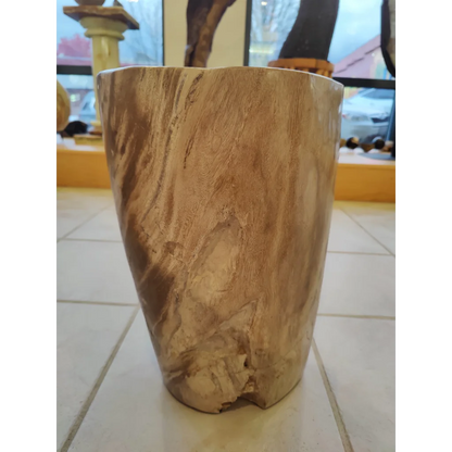 Rustic petrified wood pedestal with natural light brown grain texture