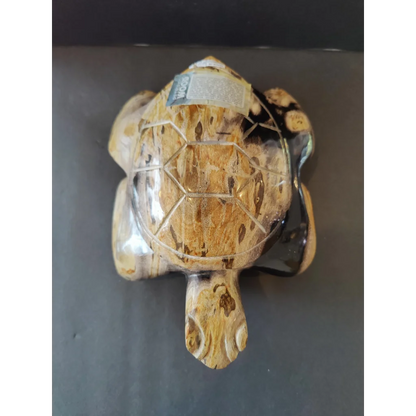 Hand-carved petrified wood turtle sculpture with natural mottled shell details