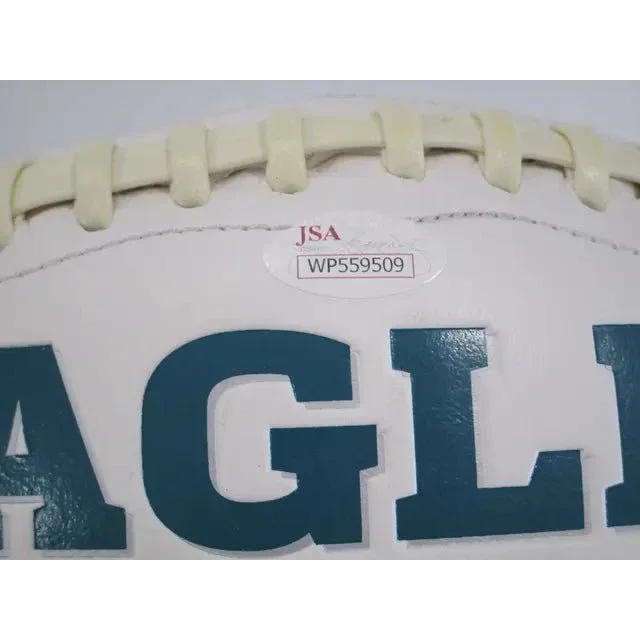 White Philadelphia Eagles signed autographed logo football with dark green lettering and JSA sticker