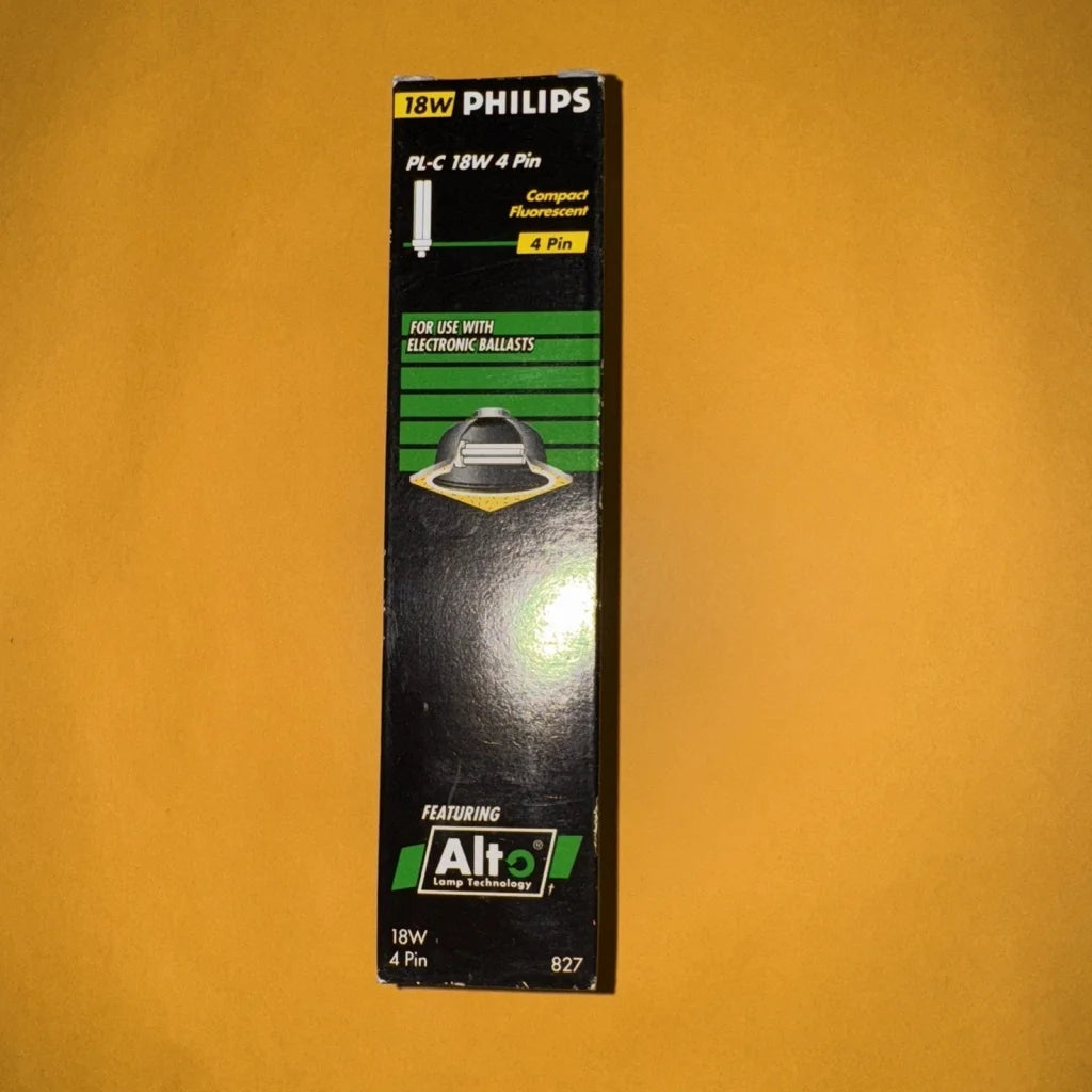 Philips 18W PL-C 4-pin CFL light bulb in black green packaging