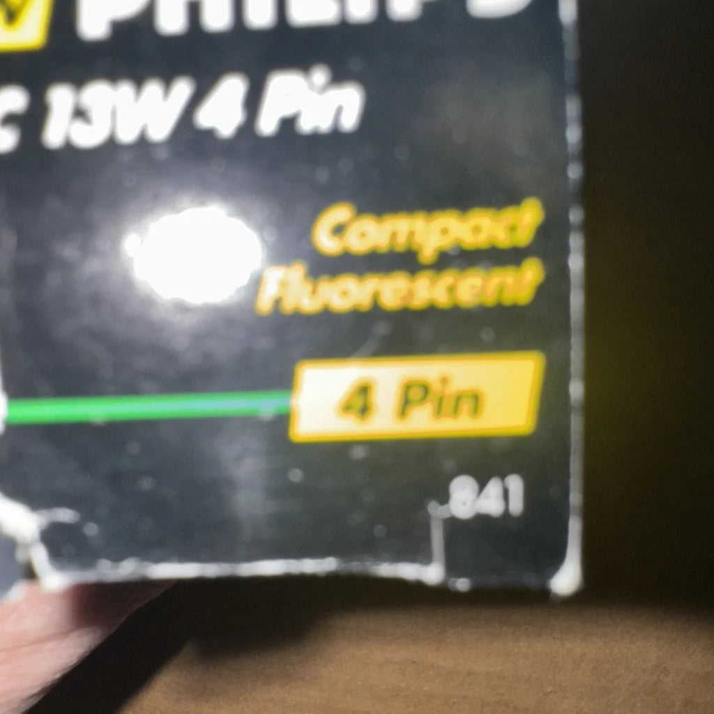 Philips PL-C 13W/835/4P Alto light bulb in black packaging
