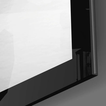 Black-framed reflective glass pane wall art in classic black and white