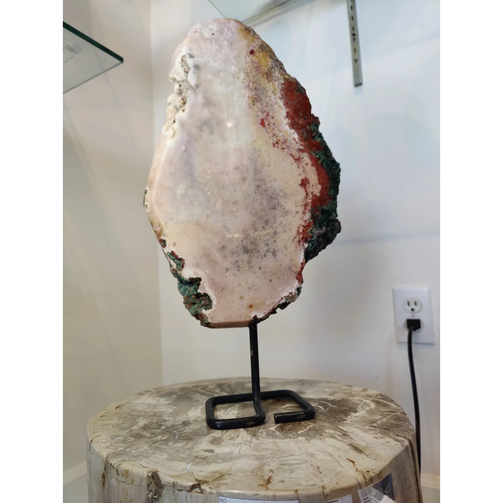 Pink amethyst polished slab sculpture with translucent white interior and red green mineral streaks on metal stand 3.11kg